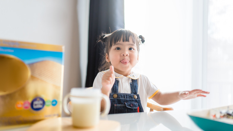 Toddler giving thumbs up