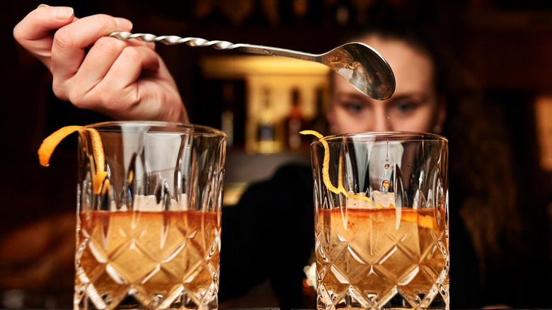 Bartender holding spoon