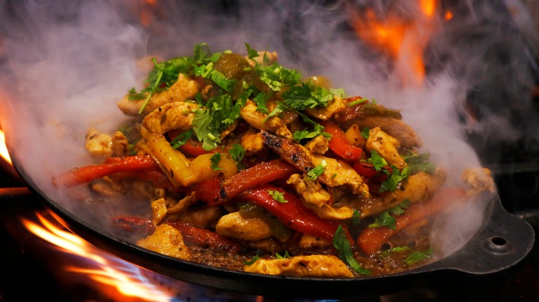 Fajitas with peppers and steak cooking 