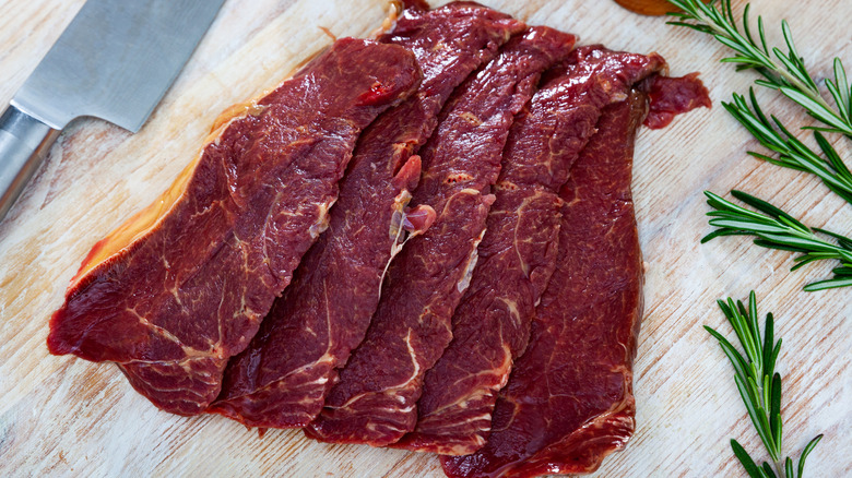 Horse meat slice on cutting board