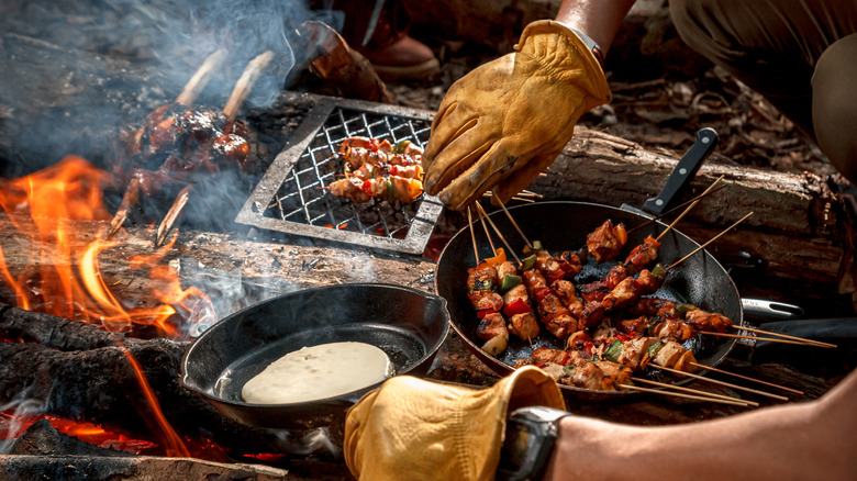 campfire cooking pancakes and skewers