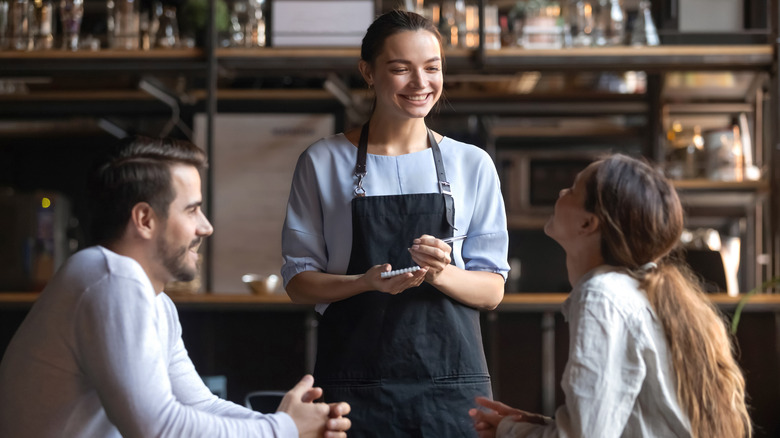 Couple ordering in restaurant