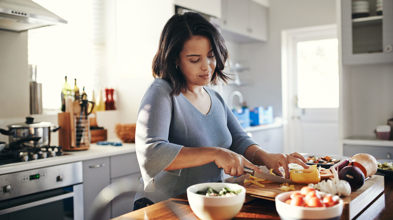 Woman cooking in home kitchen