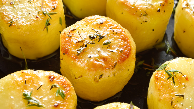 Fondant potatoes in pan 