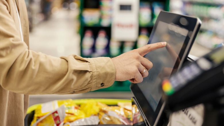 Person using self-checkout