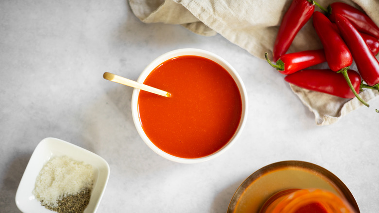 sriracha in bowl with surrounding ingredients