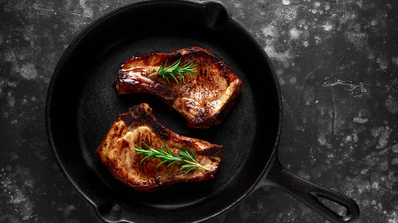 Pan fried pork chop in cast iron skillet