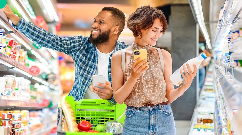 Man and woman grocery shopping