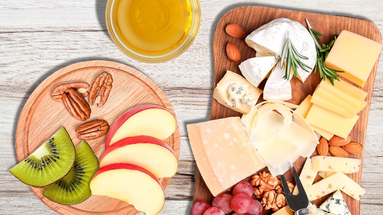 cheese board with fruits nuts