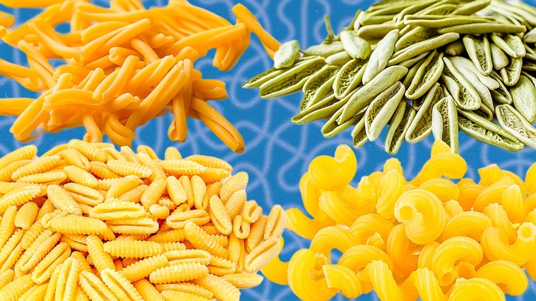 Four pasta shapes blue background