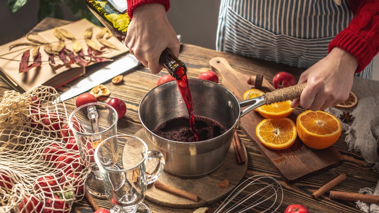 Person preparing mulled wine