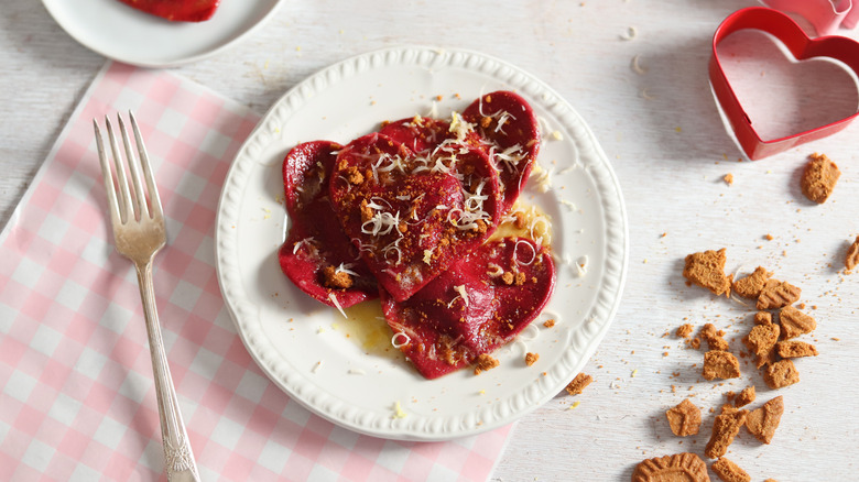 heart-shaped red ravioli on white plate