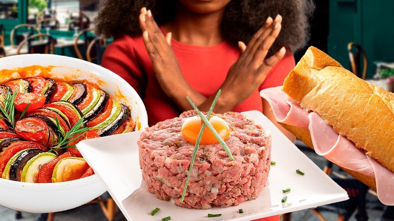 Woman saying no to French dishes at restaurant