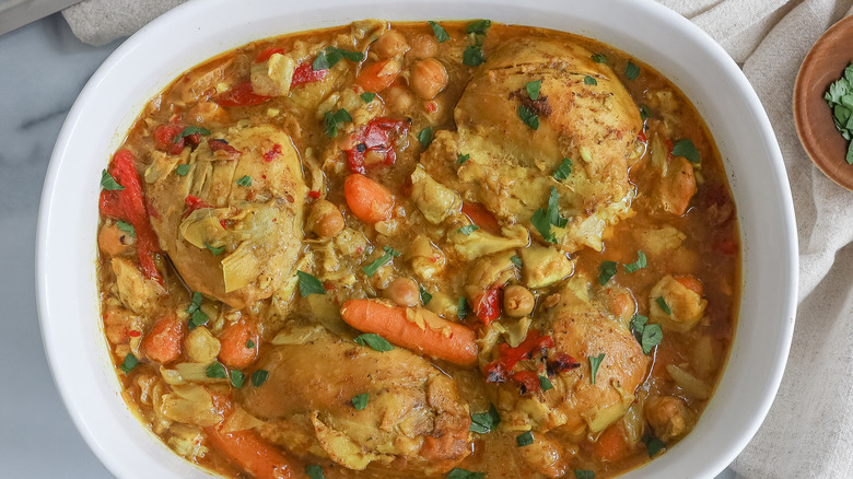 Chicken and artichoke tagine in casserole dish