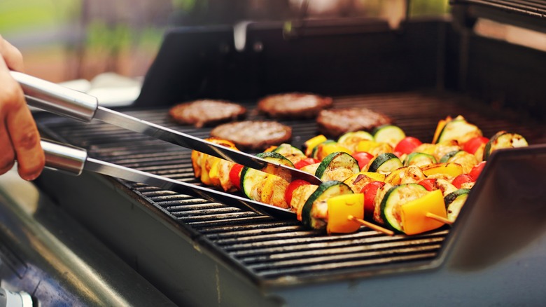 Family grilling in garden