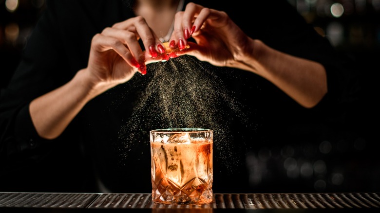 Bartender expressing citrus