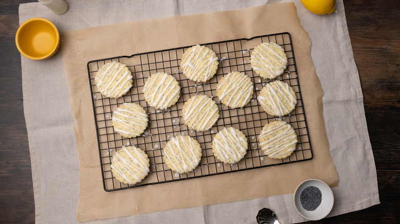 iced lemon poppyseed shortbread cookies on wire rack