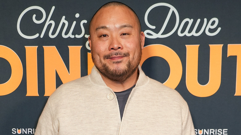 David Chang smiling in sweater