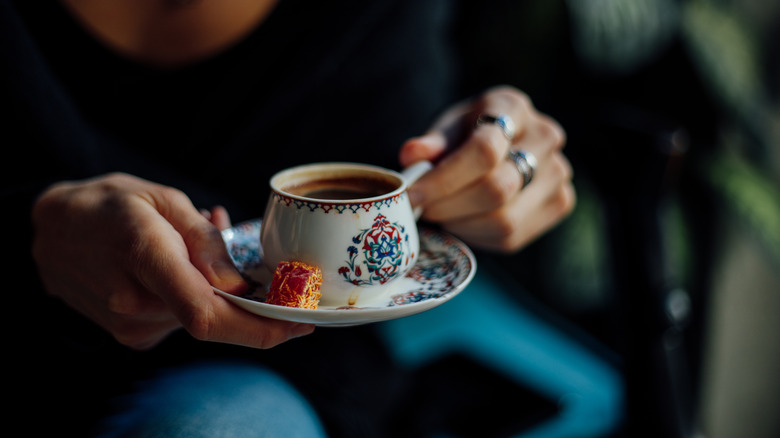 Person drinking Turkish coffee