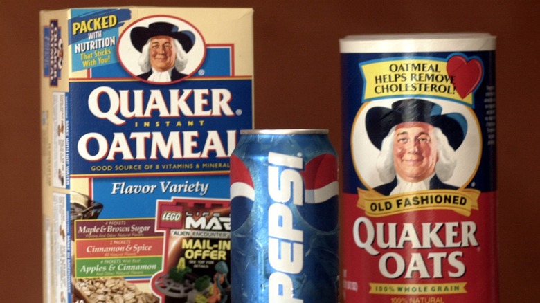 Packages of Quaker oats and oatmeal next to a can of Pepsi