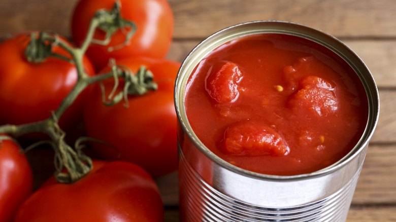 fresh and canned tomatoes next to each other