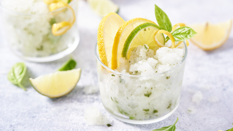 granita in serving glass with citrus garnish