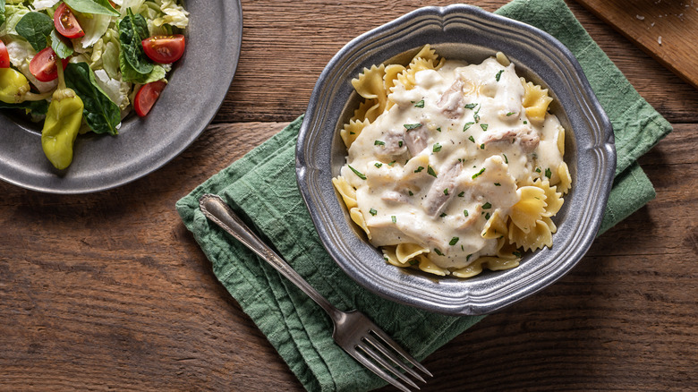 alfredo sauce over bowtie pasta