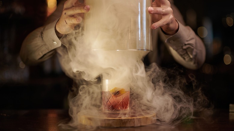 bartender smoking cocktail