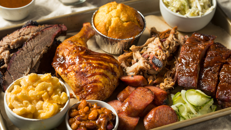 a platter of bbq and sides