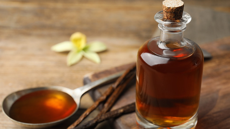 vanilla extract in bottle and spoon