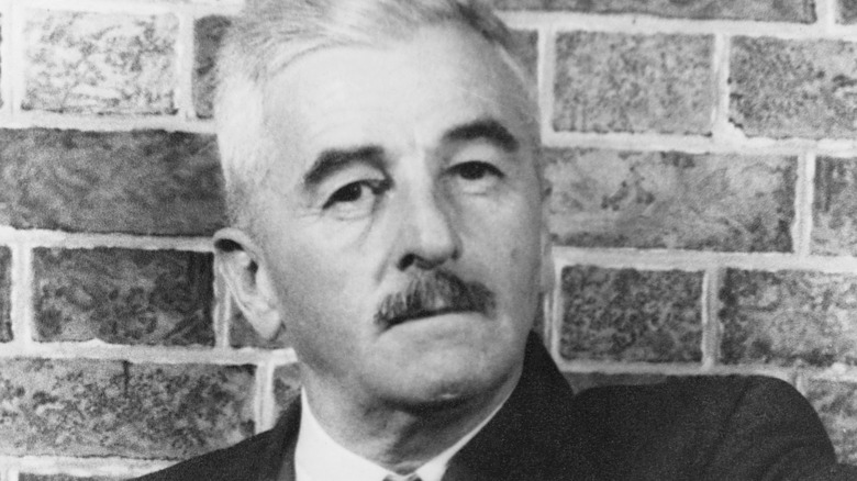 William Faulkner posing