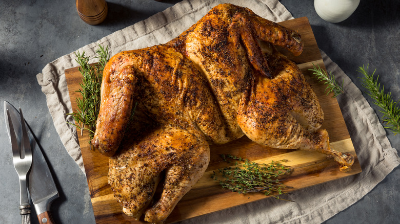 Spatchcocked chicken on cutting board