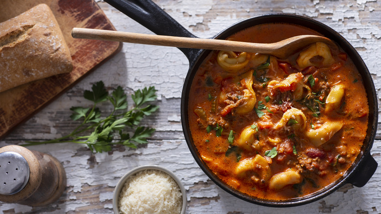 Tortellini with sauce in cast iron pan