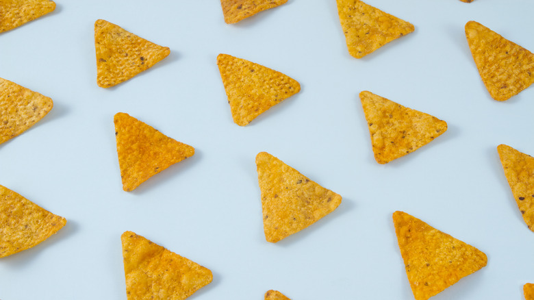 Tortilla chips on blue background