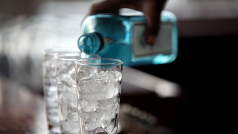 pouring gin from a bottle