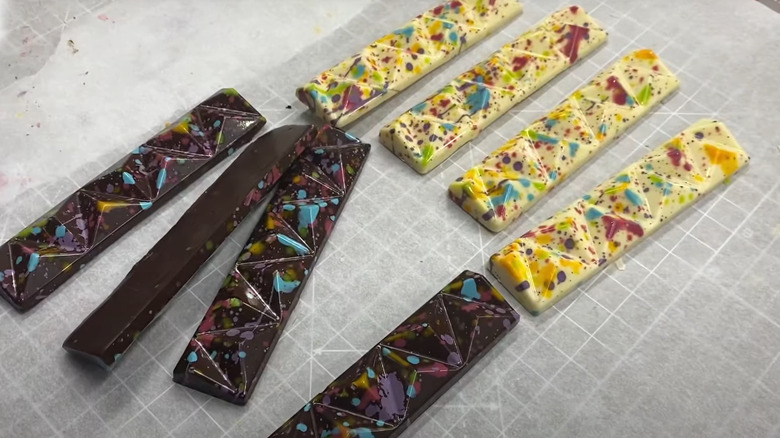 paint-splattered white and dark chocolate bars